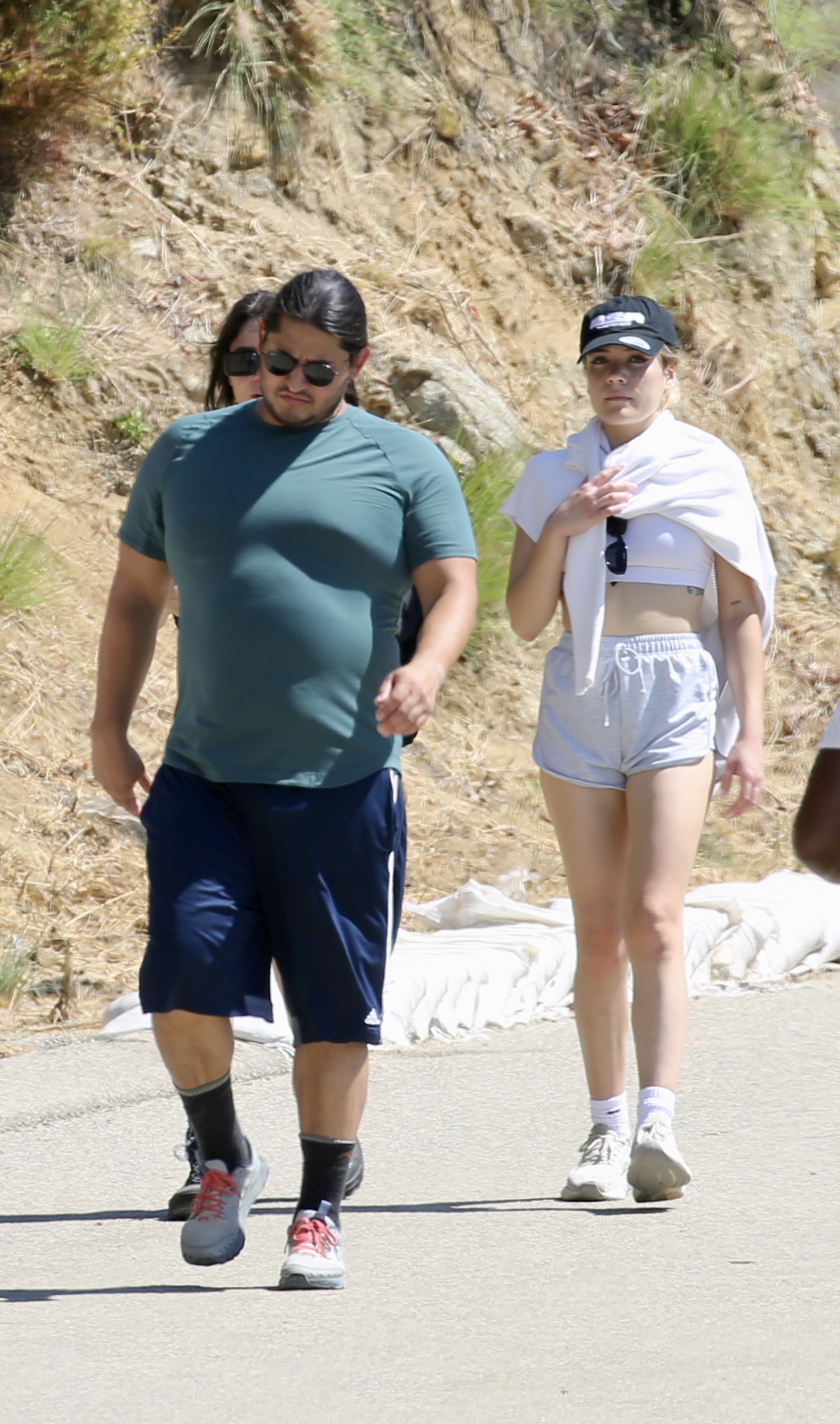 Payten Vincent was seen walking behind her new love wearing gray shorts and a white crop top