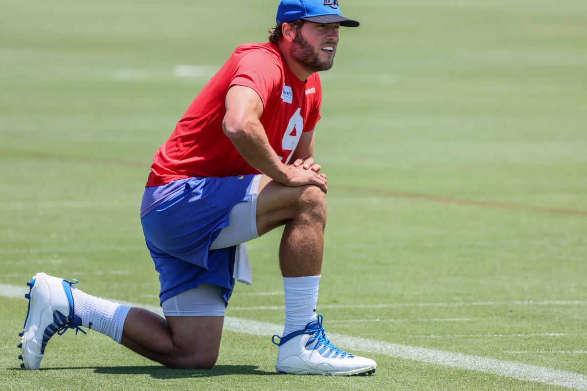 Rams quarterback Matthew Stafford stretches during an OTA practice at Cal Lutheran University.