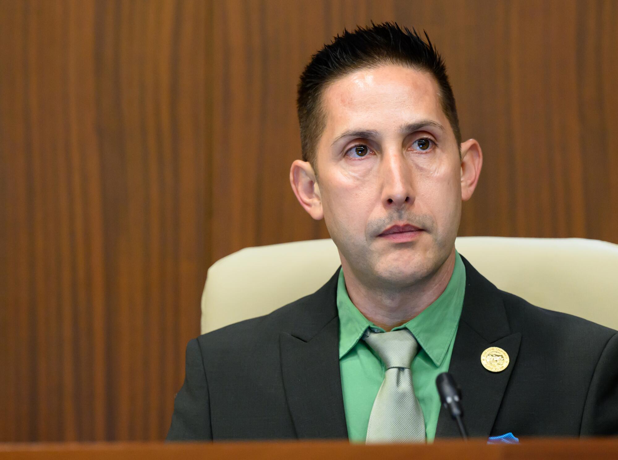 A man wearing a suit and tie.