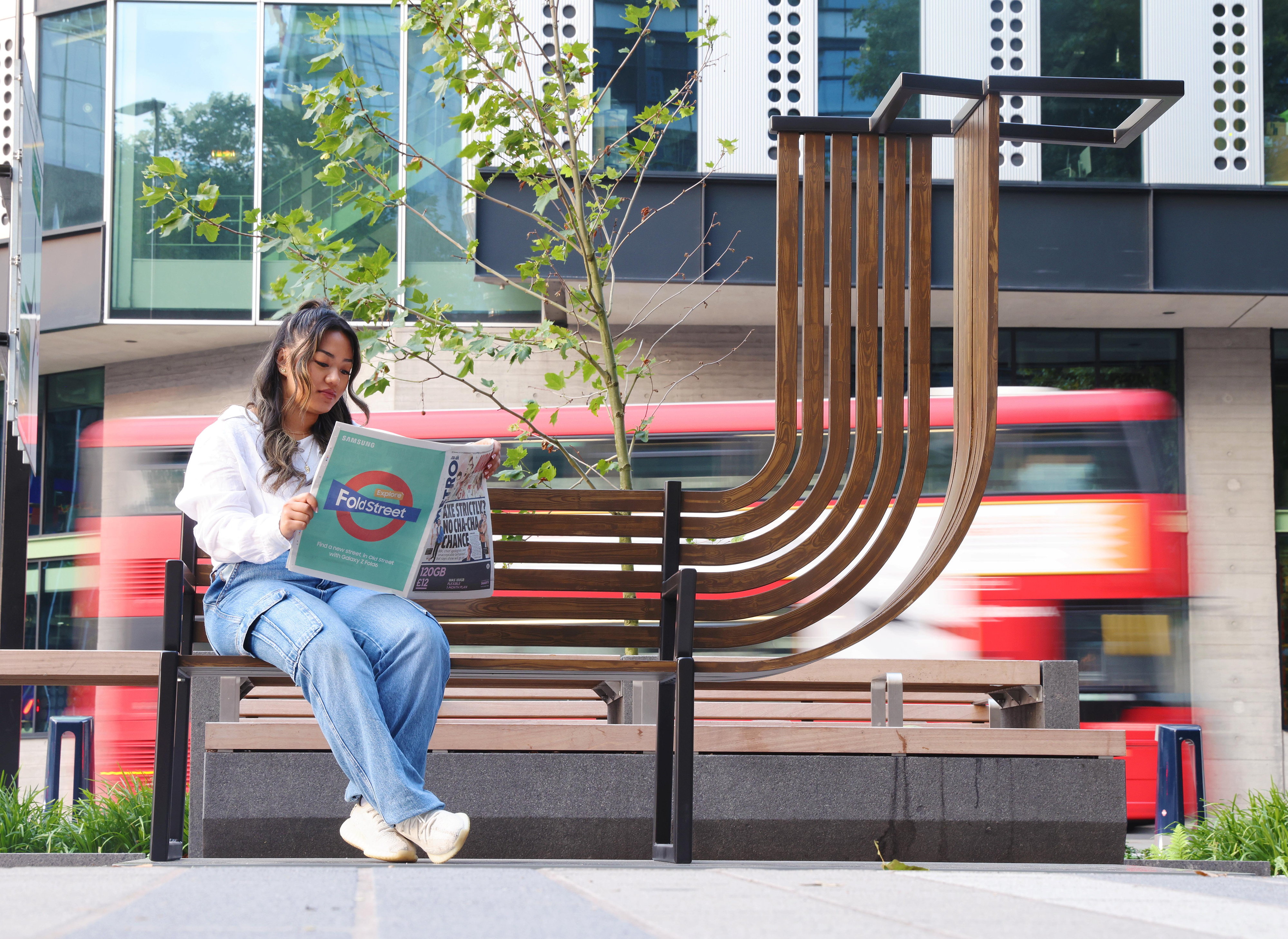 A folded lamppost and bench are unveiled with contortionists at Old Street, London