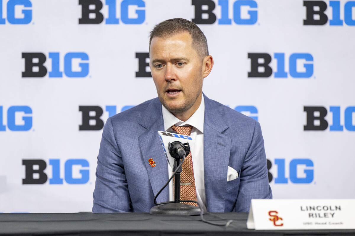 USC coach Lincoln Riley talks with reporters during a news conference at Big Ten media days 