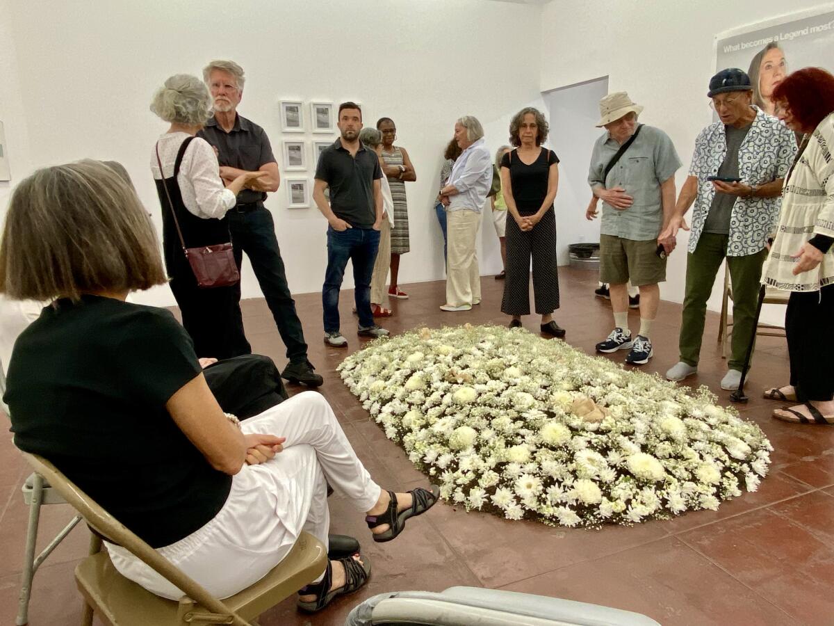 A Nancy Youdelman installation of soil and flowers rises from the floor of As Is Gallery in L.A.