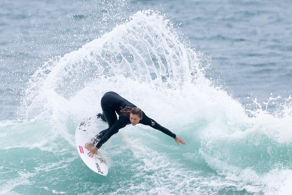 A surfer rides a wave at Lower Trestles offshore of San Clemente