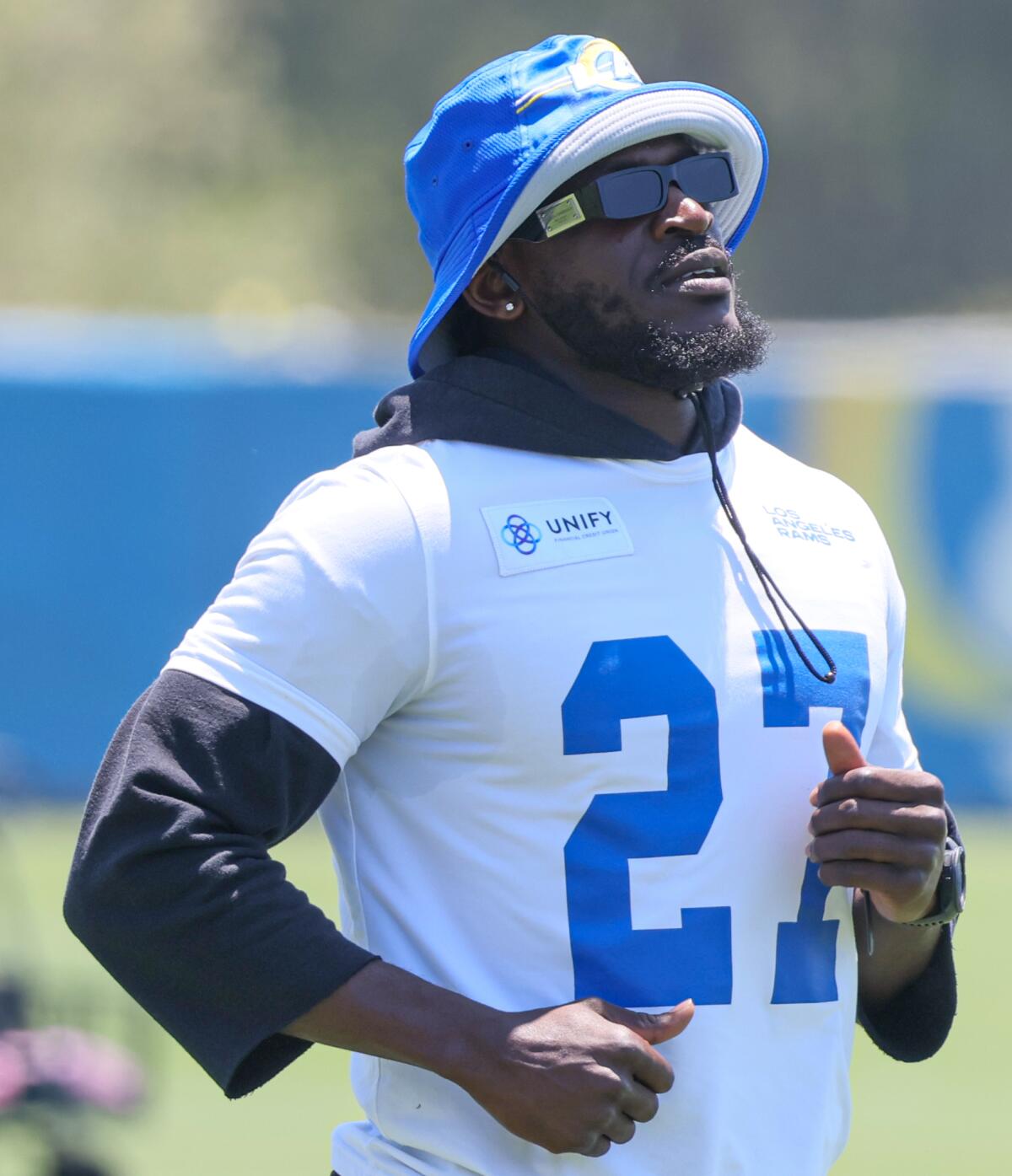  Rams defensive back Tre'Davious White loosens up at practice while adorning a hat.