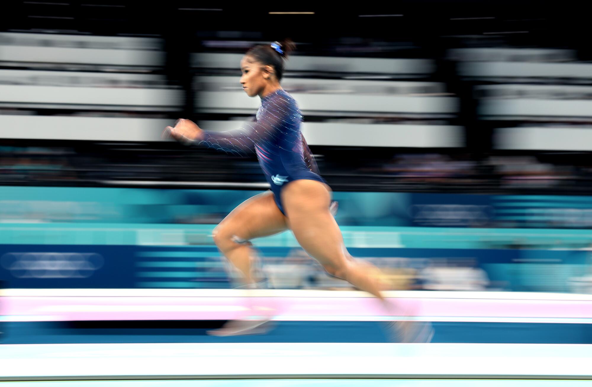 Jordan Chiles sprints while practicing the vault on Thursday.