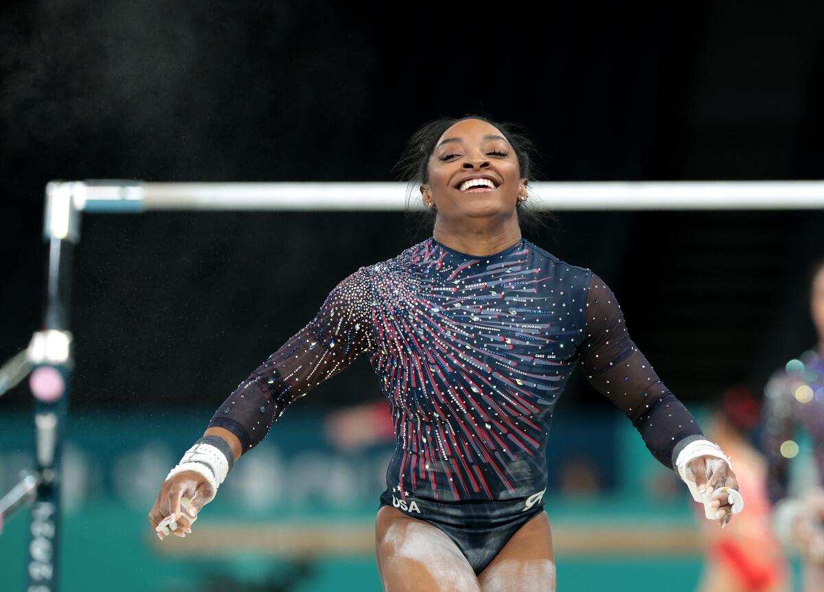 U.S. gymnast Simon Biles smiles during podium training ahead of the 2024 Olympics Thursday in Paris.