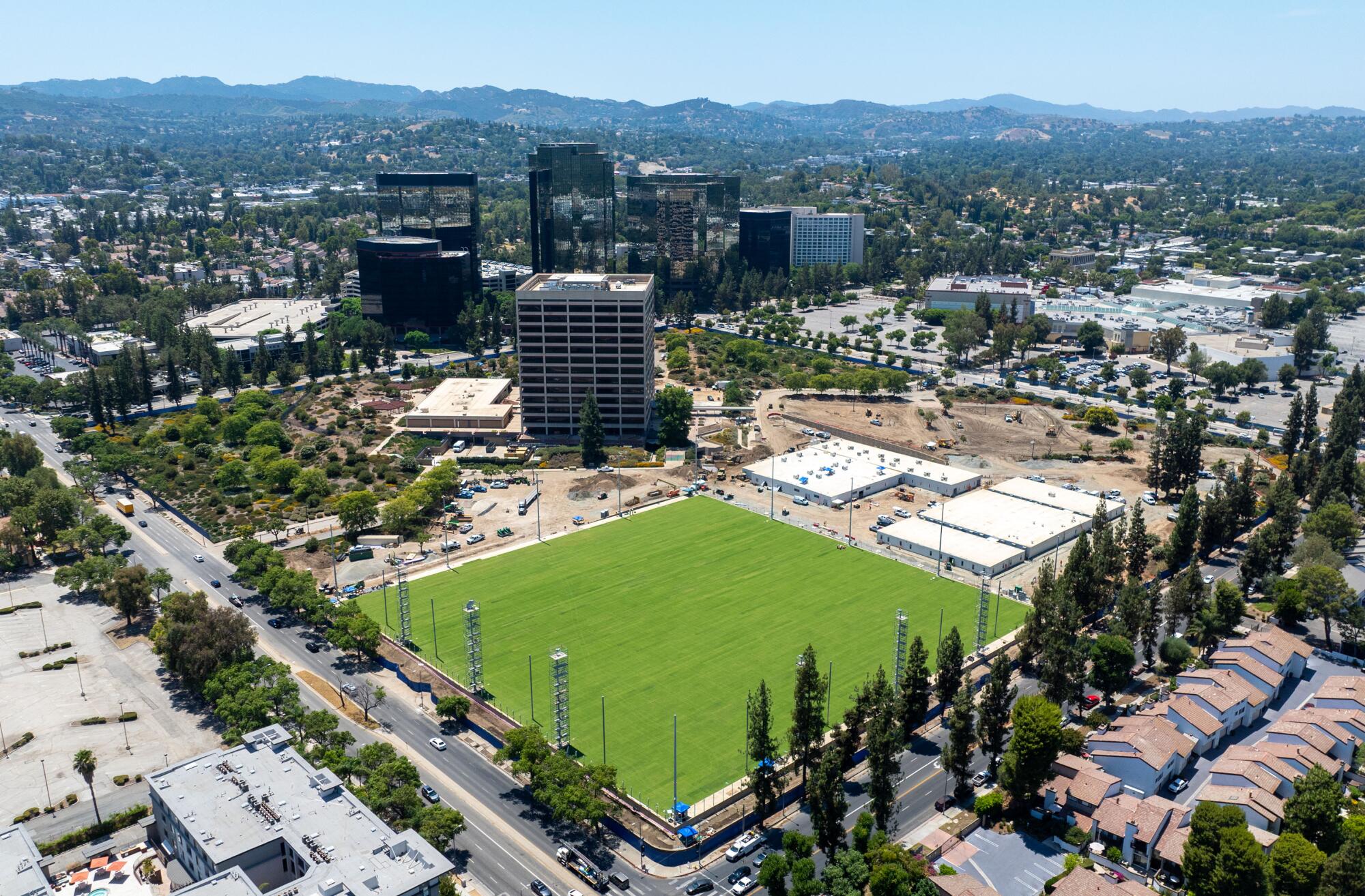 The grass is green on two practice fields at the new Rams training facility under construction in Woodland Hills.