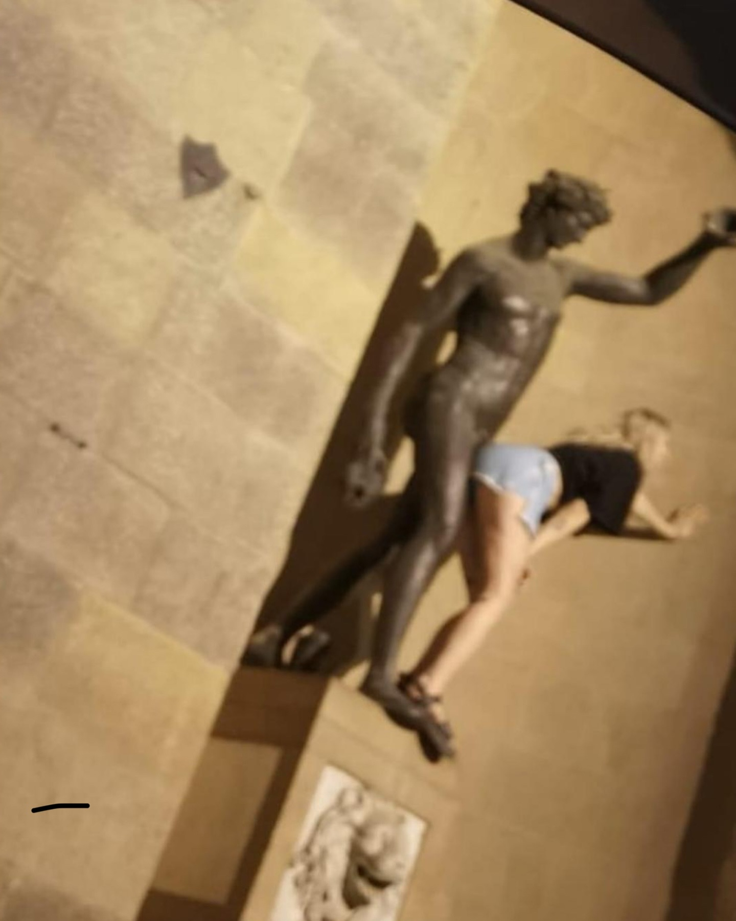 A female holidaymaker was photographed mimicking sexual acts on a famed statue in Florence