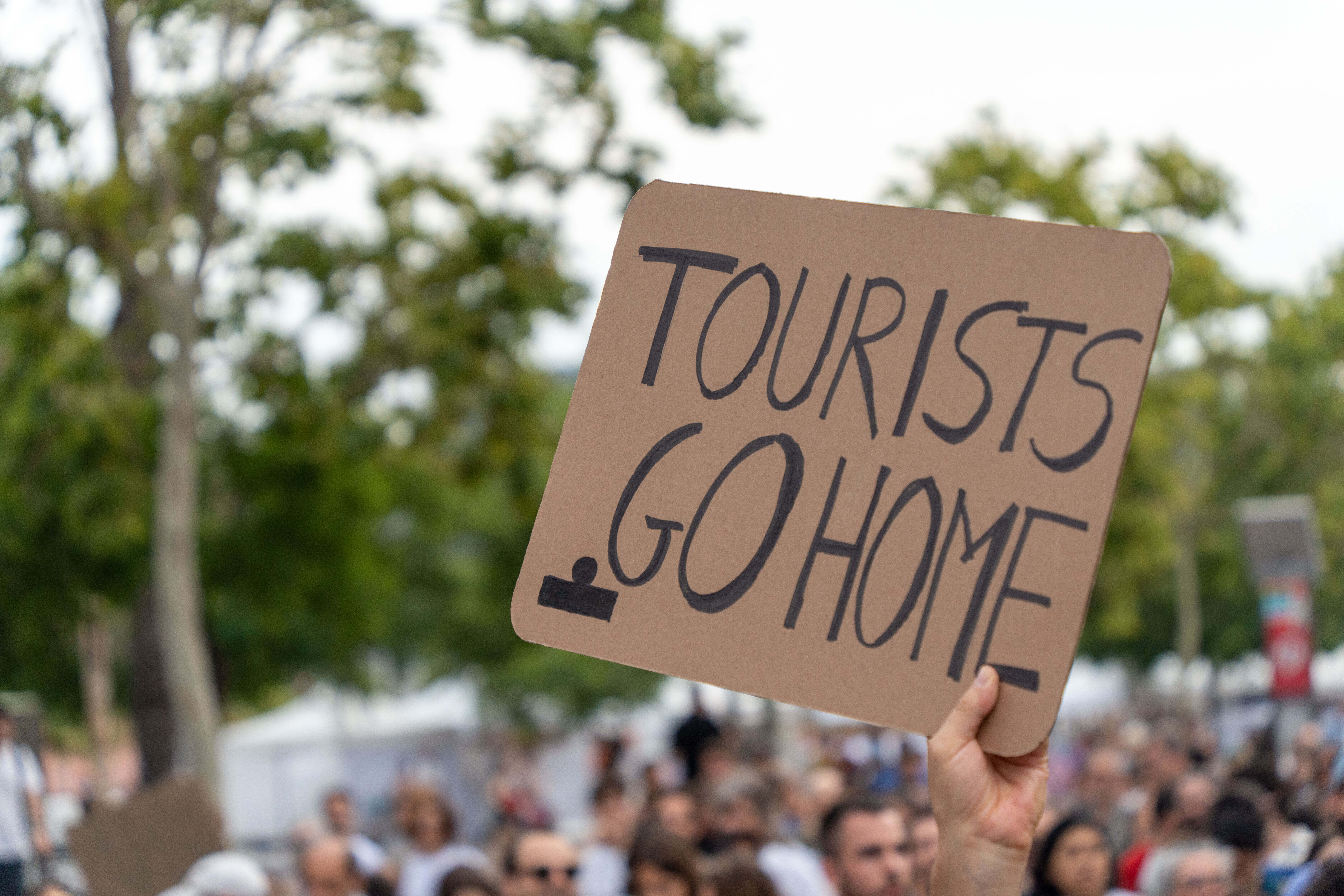 Residents across Europe have protested with signs bearing slogans like 'Tourists go home'