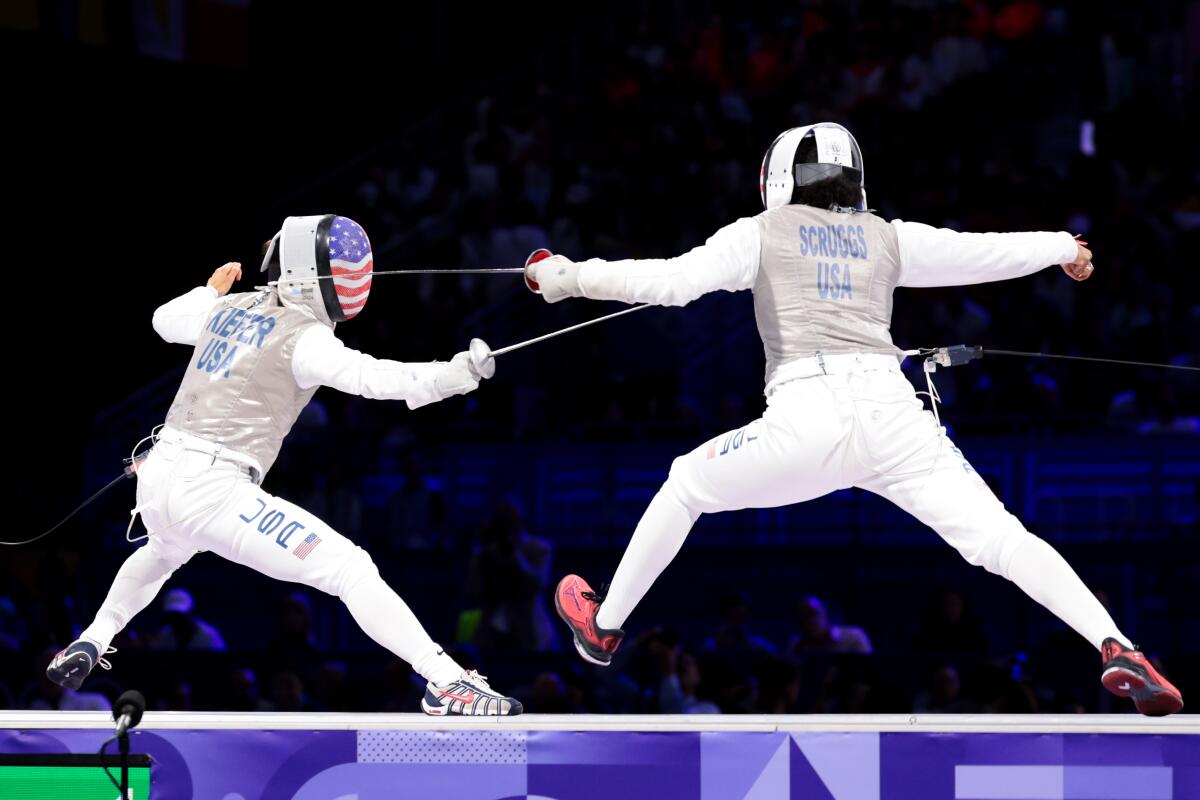 Lee Kiefer, left, faced off with Lauren Scruggs in an all-American women's foil final on Sunday.