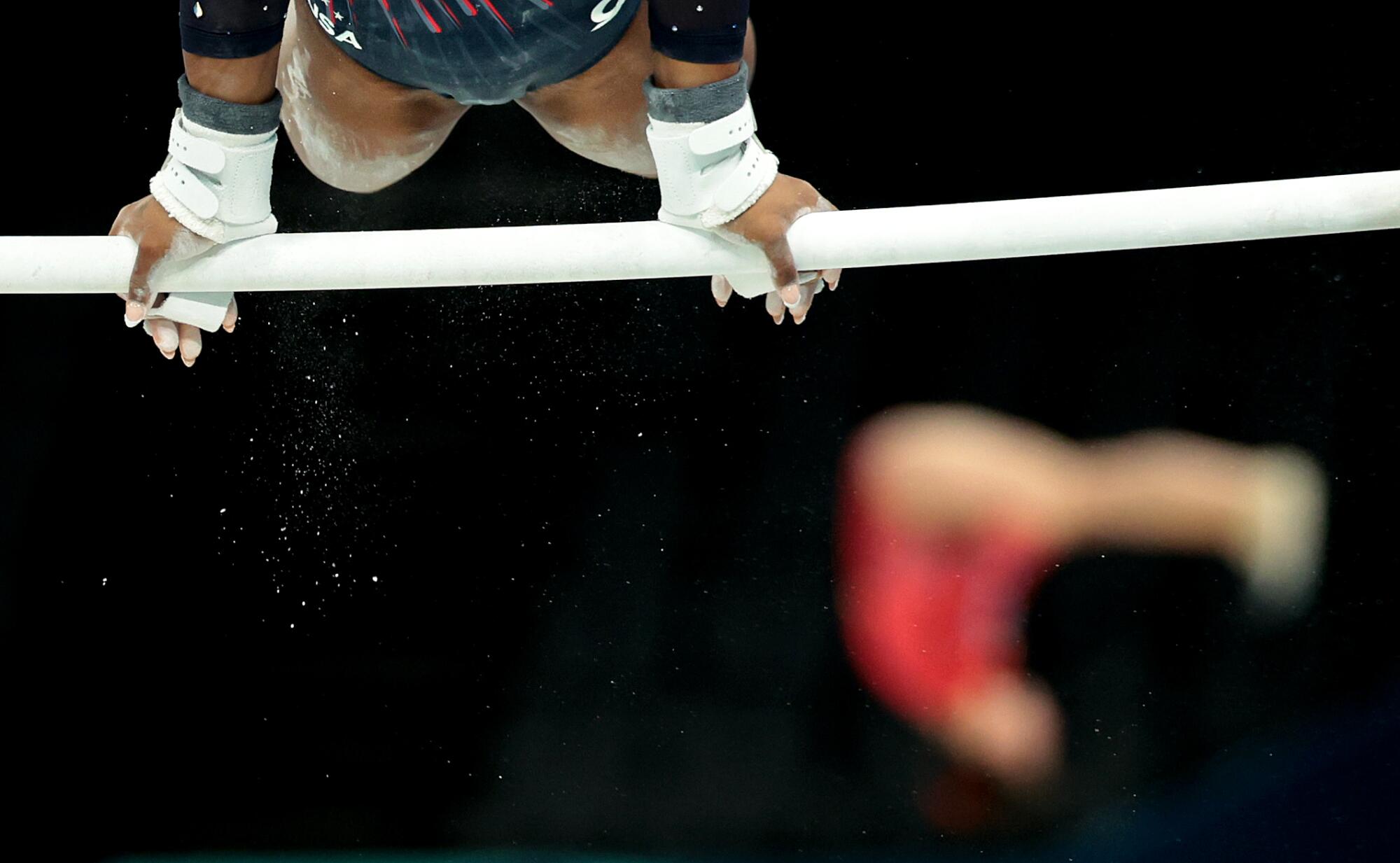 U.S. gymnast Simone Biles performs on the uneven bars.