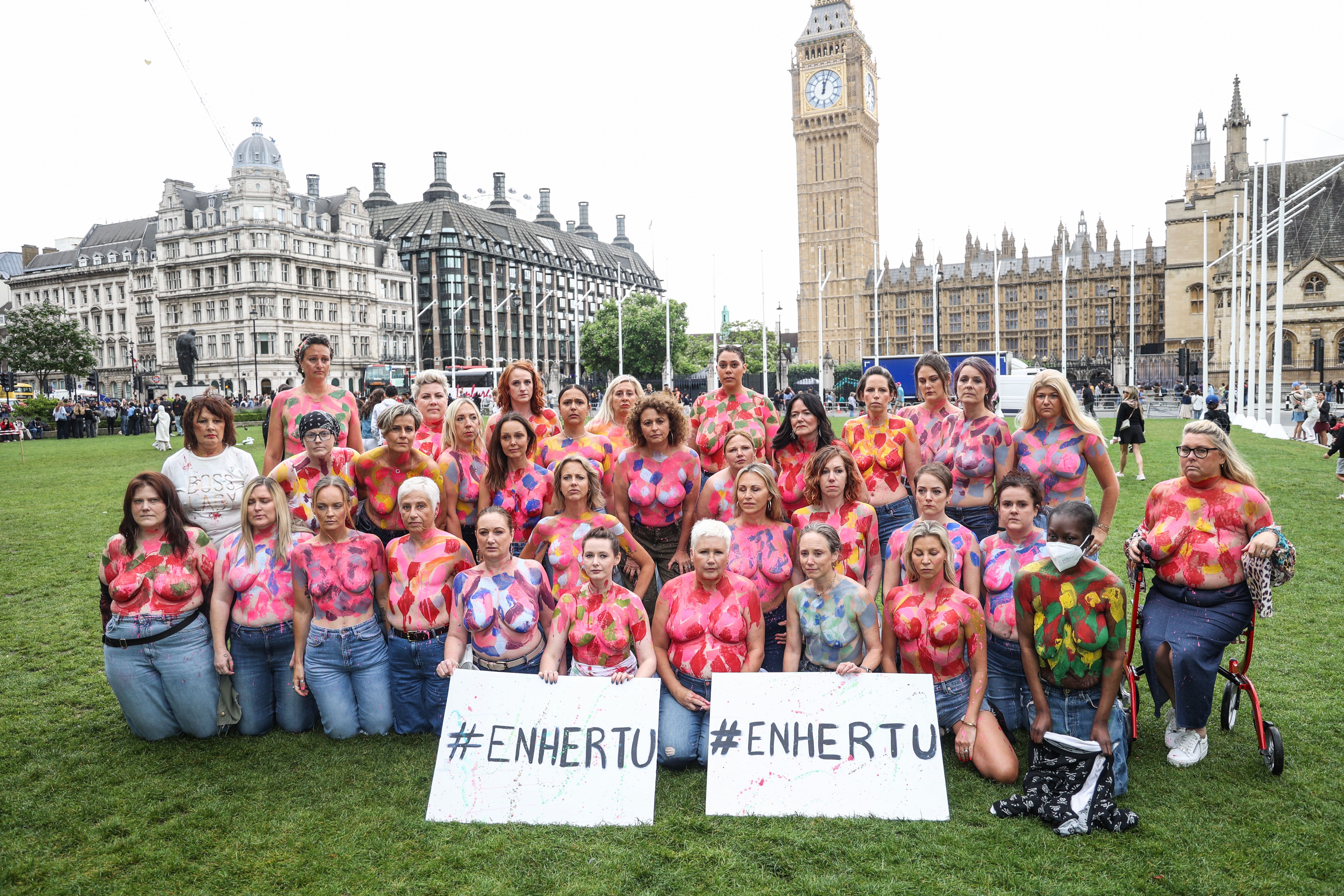 Campaigners stripped off for a topless protest outside the Houses of Parliament earlier in July