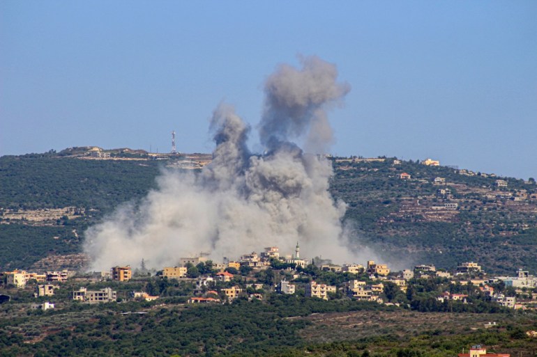 Smoke billows following an Israeli airstrike in the southern Lebanese border village of Chihine