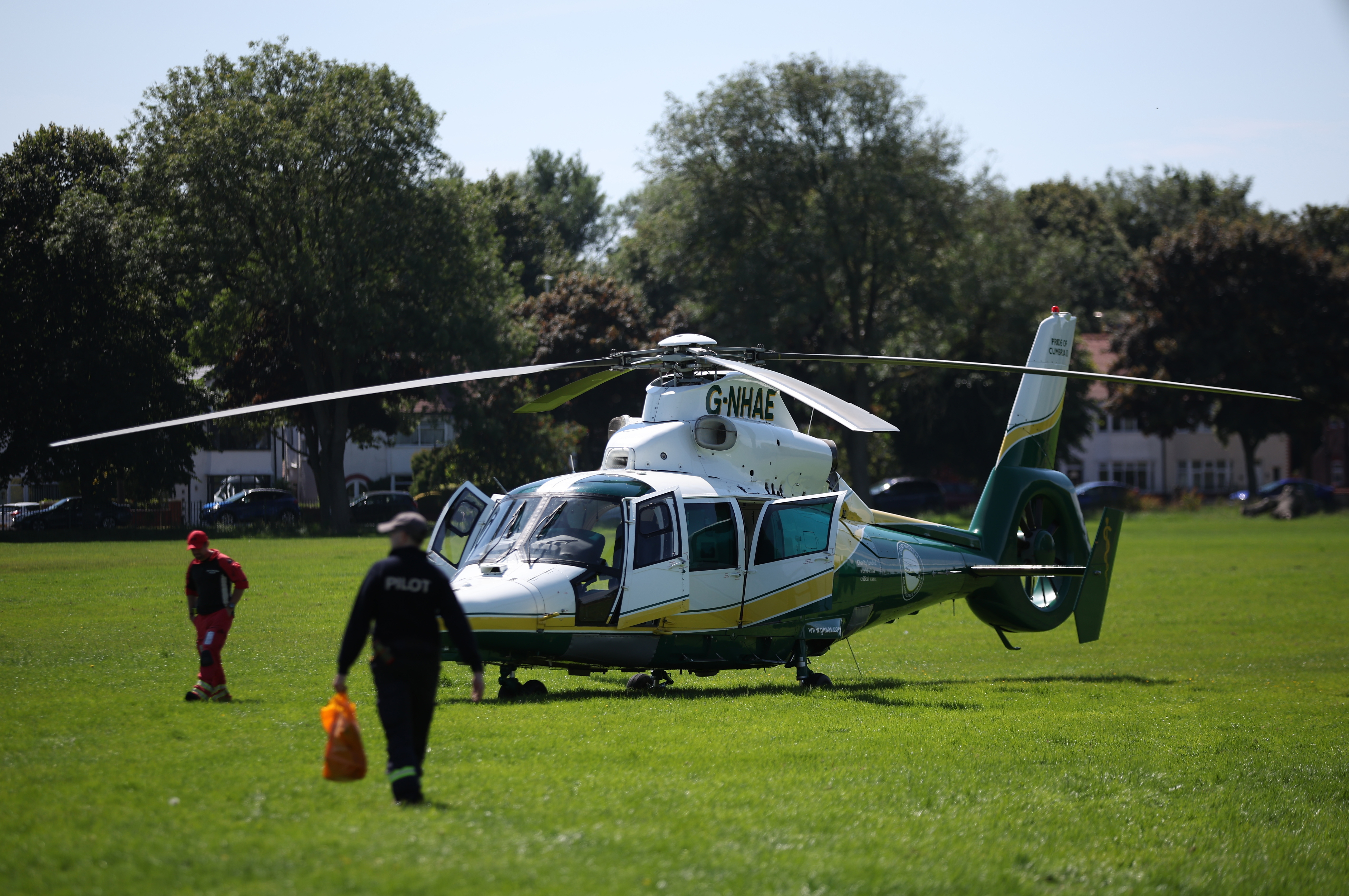 An air ambulance landed near the police cordon