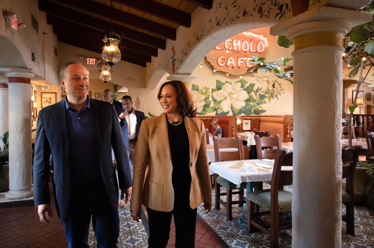 Vice President Kamala Harris and Second Gentleman Doug Emhoff walk into El Cholo in Santa Monica last year.