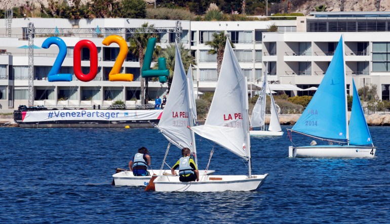 Children sail on boats at the site of the future Olympic Sailing venue (Voile Olympique) at the "Marina Olympique" nautical base in Marseille, France, after the decision for Paris to host of the 2024 Summer Olympics Games, September 21, 2017. REUTERS/Jean-Paul Pelissier