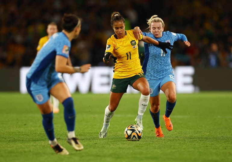 Soccer Football - FIFA Women’s World Cup Australia and New Zealand 2023 - Semi Final - Australia v England - Stadium Australia, Sydney, Australia - August 16, 2023 Australia's Mary Fowler in action with England's Lauren Hemp REUTERS/Hannah Mckay