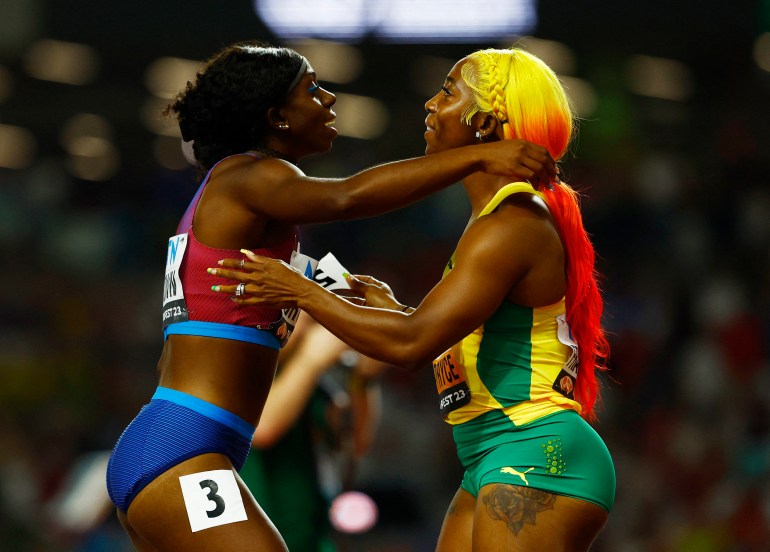 Athletes hug after race.