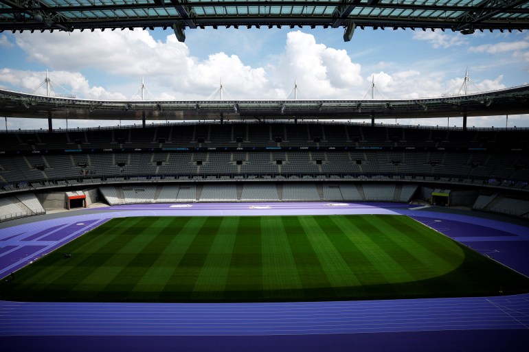 A general view shows the Paris 2024 Olympic and Paralympic Games' athletics track of two shades of purple manufactured by Mondo Sports Flooring inside the Stade de France stadium, in Saint-Denis near Paris, France, May 7, 2024. REUTERS/Sarah Meyssonnier