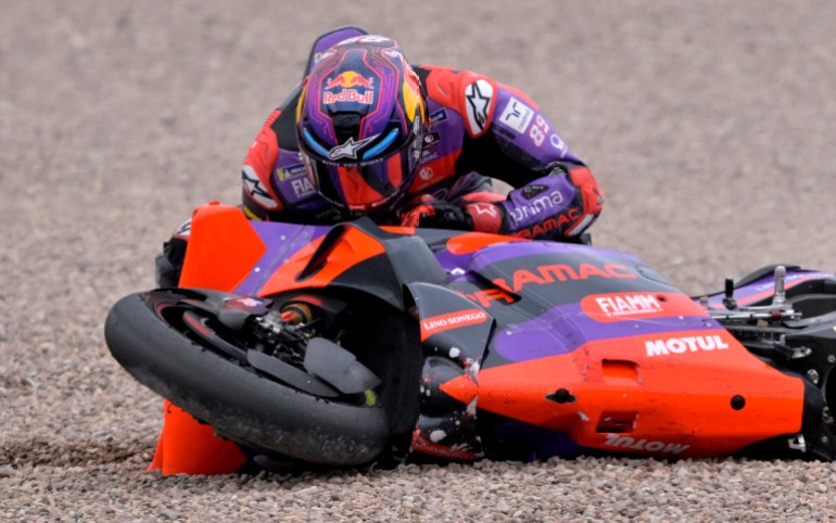 Rider drops bike on track.