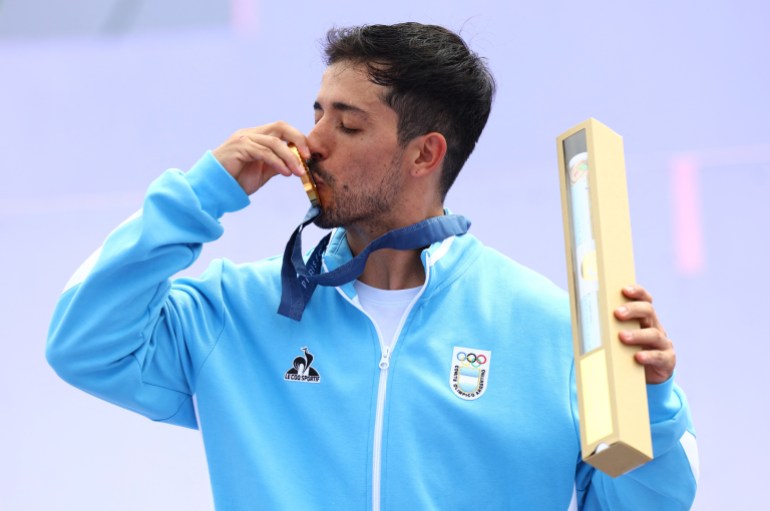 Paris 2024 Olympics - BMX Freestyle - Men's Park Victory Ceremony - La Concorde 2, Paris, France - July 31, 2024. Gold medallist Jose Torres Gil of Argentina celebrates with his medal. REUTERS/Esa Alexander