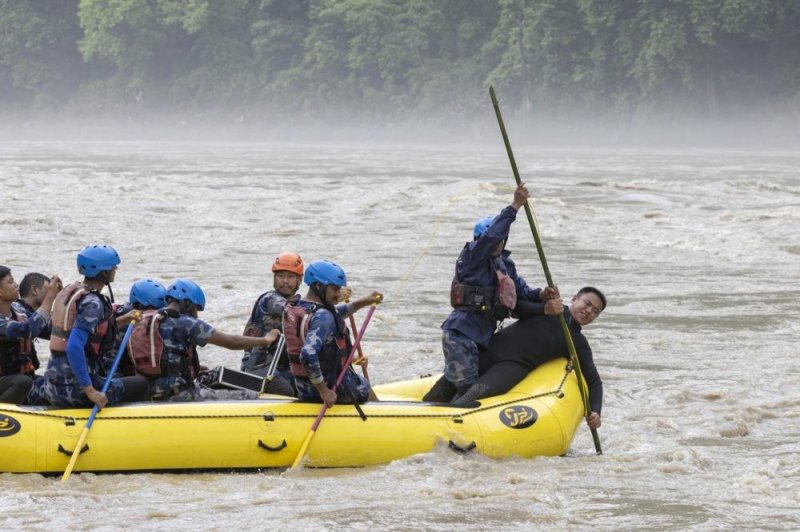 Crews recovered two bodies Saturday in Nepal, but the search continued for more than 50 other people who were suddenly swept into a river when the two buses they were riding were hit by a massive landslide. Photo by Narendra Shrestha/EPA-EFE