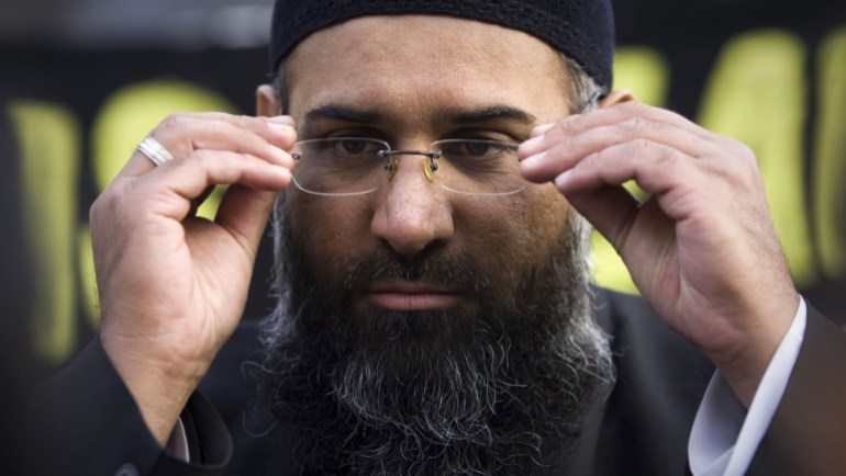 Islamic preacher Choudary addresses members of the media during a protest supporting the Shari''ah Law, in north London