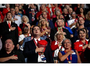 Delegates during the National Anthem at the Republican National Convention in Milwaukee.