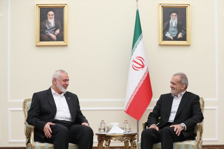 TEHRAN, IRAN - JULY 30: (----EDITORIAL USE ONLY - MANDATORY CREDIT - 'IRANIAN PRESIDENCY / HANDOUT' - NO MARKETING NO ADVERTISING CAMPAIGNS - DISTRIBUTED AS A SERVICE TO CLIENTS----) Iranian newly-elected President Masoud Pezeshkian (R) meets Head of the Palestinian Hamas group's political bureau Ismail Haniyeh (L) in Tehran, Iran on July 30, 2024.