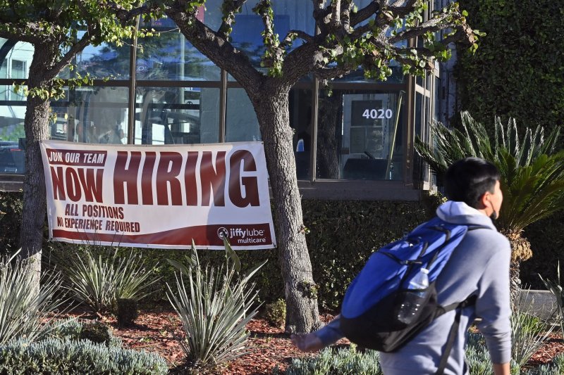 A "now hiring" sign is seen outside the Jiffy Lube in Los Angeles, California on January 27, 2021. The new ADP National Employment Report said the economy created 150,000 jobs in June. File Photo by Jim Ruymen/UPI