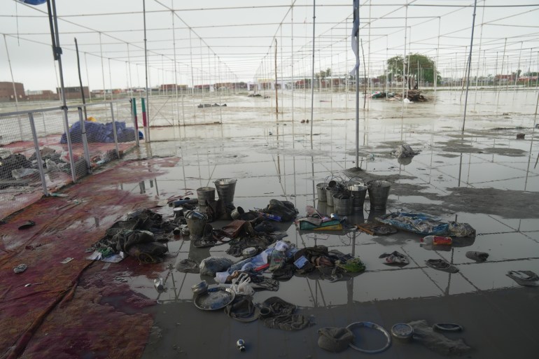 Belongings of people are seen at the site where devotees had gathered for a Hindu religious congregation, following which a stampede occurred, in Hathras district, Uttar Pradesh