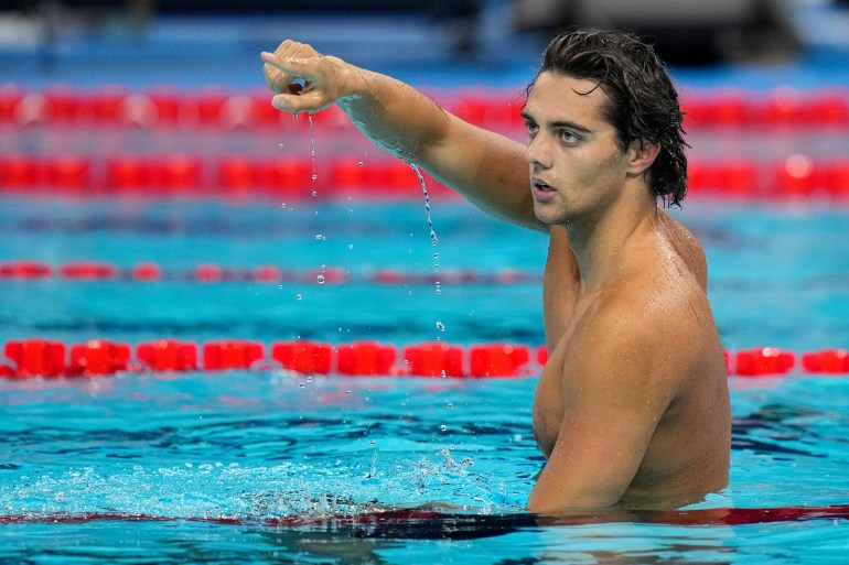 Thomas Ceccon, of Italy, reacts after winning the men's 100-meter backstroke final at the 2024 Summer Olympics, Monday, July 29, 2024, in Nanterre, France. (AP Photo/Bernat Armangue)