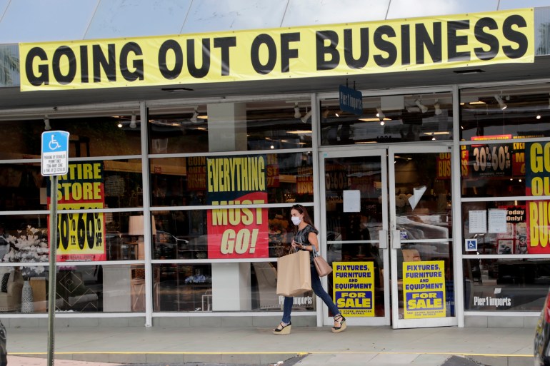 a customer leaves a Pier 1 retail store, which is going out of business, during the coronavirus pandemic in Coral Gables, Florida, USA