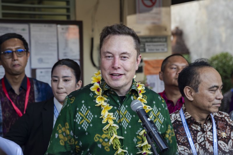 Elon Musk talks to the media after the launch of Starlink at a sub-district community health center in Denpasar, Bali, Indonesia in May. On Tuesday he announced he is moving the headquarters of SpaceX and social media platform X from California to Texas following the enactment of California's SAFETY Act. File Photo by Made Nagi/EPA-EFE