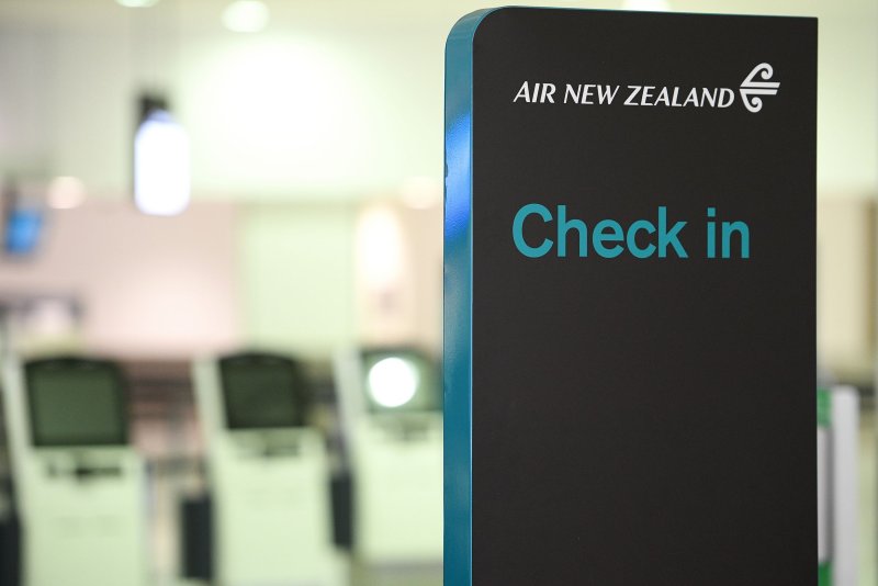 Image of Air New Zealand check-in counter at Sydney International Airport in Sydney, Australia, on June 23, 2021. Air New Zealand said on Tuesday it was moving away from 2030 climate change goals. File Photo by Dan Himbrechts/EPA-EFE