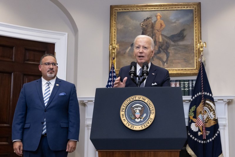 U.S. President Joe Biden delivers remarks beside US Secretary of Education Miguel Cardona (L) in the Roosevelt Room of the White House in Washington, D.C., in June of 2023. On Thursday, a federal appeals court blocked their SAVE plan to offer student debt relief from going into effect. Photo by Michael Reynolds/UPI