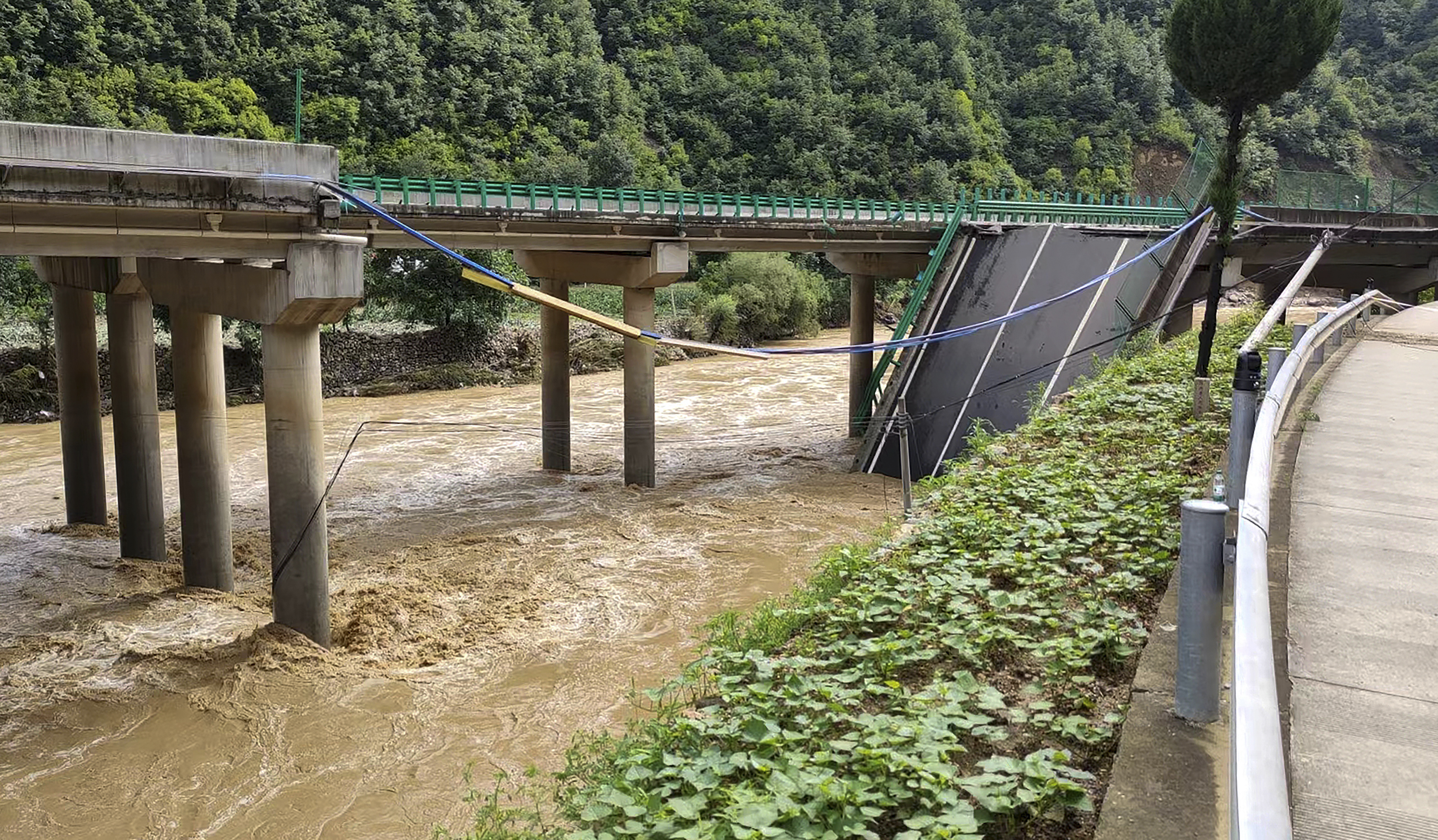 A collapsed bridge is seen in Zhashui County in Shangluo City, northwest China’s Shaanxi Province