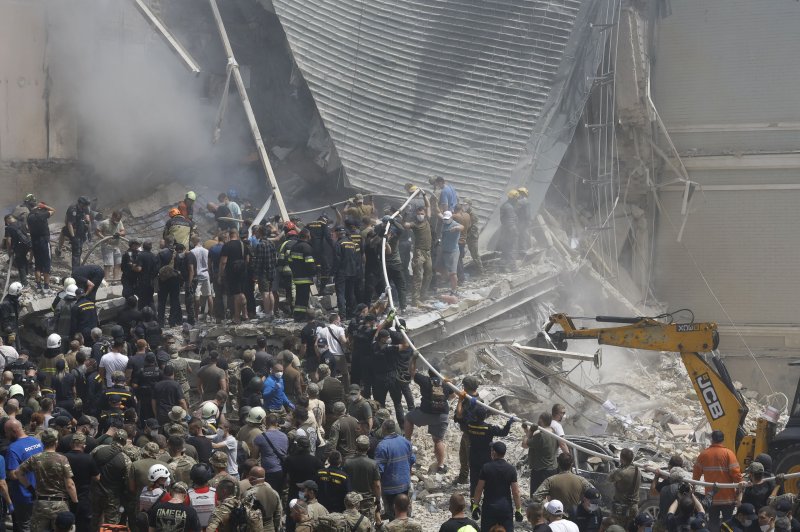 Emergency workers search for survivors of a missile strike on the Okhmadyt Children's Hospital in Kyiv, Ukraine, on Monday that killed at least two people and injured 16 in a wave of deadly Russian attacks on cities across central and eastern regions of the country. Photo by Sergey Dolzhenko/EPA-EFE