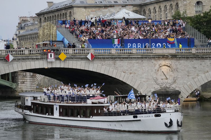 A boat carrying athletes from Team Greece travels on the river Seine in the Parade of Nations during the Opening Ceremony of the Paris 2024 Olympic Games in Paris on Friday, Photo by Paul Hanna/UPI