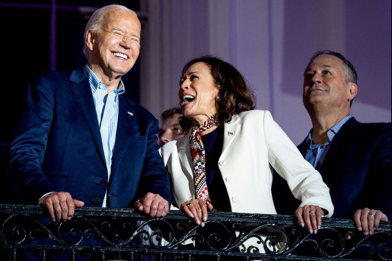 US President Joe Biden, Vice President Kamala Harris, and Second Gentleman Doug Emhoff view Fourth of July fireworks from the Truman Balcony of the White House in Washington, DC on Thursday, July 4, 2024. File Photo by Tierney L. Cross/UPI