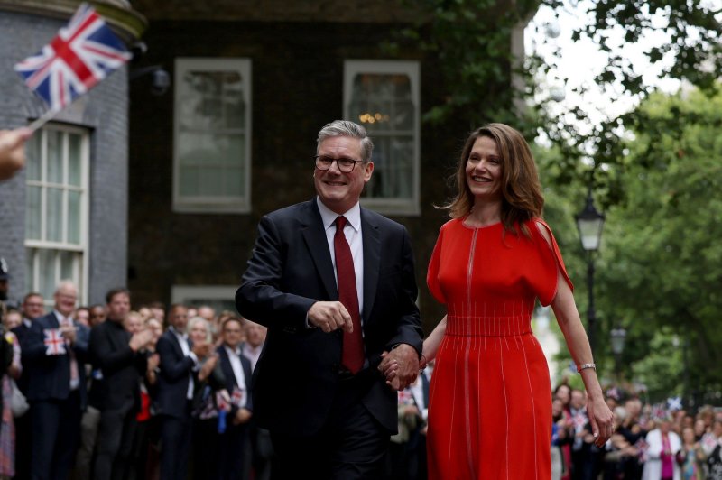 The Prime Minister, Sir Keir Starmer, and his wife, Victoria, arrive at Number 10 Downing Street in London, delivering his first speech to the nation as the head of government of the United Kingdom on Friday. Photo by Rory Arnold/No 10 Downing Street/UPI