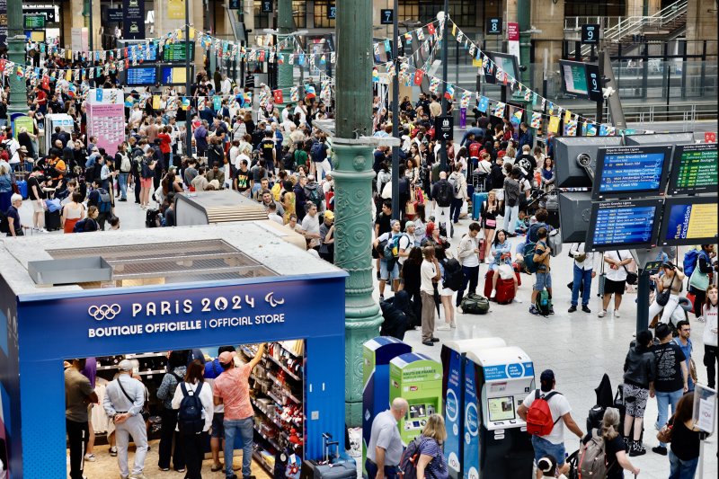 Stranded passengers at Paris' Gare du Nord station on Friday await travel updates after coordinated sabotage of large parts of France's high-speed TGV rail network ahead of the opening of the 2024 summer olympics. At least 250,000 travelers were expected to be affected and more than 800,000 over the weekend. Photo by Ritchie B. Tongo/EPA-EFE