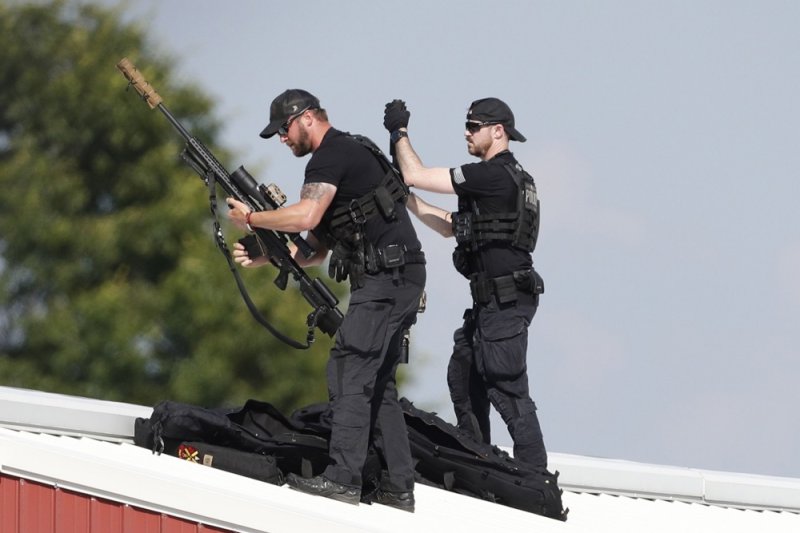 Law enforcement snipers set up before the arrival of former president Trump on a rooftop overlooking a campaign rally at the Butler Farm Show Inc. in Butler, Pennsylvania Saturday. During the campaign rally Trump was rushed off stage by Secret Service after a shooting. A man attending the rally was fatally shot. Photo by David Maxwell/EPA-EFE