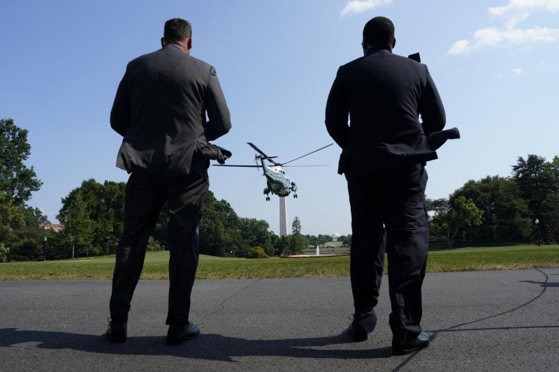 Secret Service agents watch as Marine One helicopter with President Joe Biden on board departs from the South Lawn of the White House in Washington as he departs to Las Vegas on Monday, July 15, 2024. Photo by Yuri Gripas/UPI