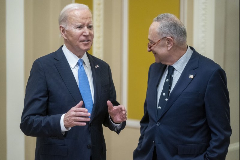 US President Joe Biden and Senate Majority Leader Chuck Schumer respond to questions from the news media following a meeting with Senate Democrats for a policy luncheon at the US Capitol in Washington, DC on March 2, 2023. File Photo by Shawn Thew/UPI