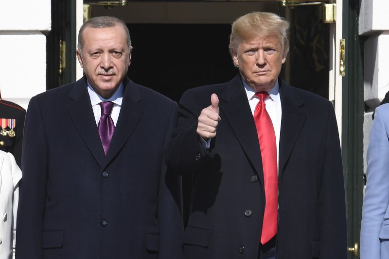 President Donald Trump (R) gives a thumbs up to the press as he welcomes Turkish President Recep Tayyip Erdogan (L) and his wife Emine Erdogan, to the White House in November 2019. File Photo by Mike Theiler/UPI