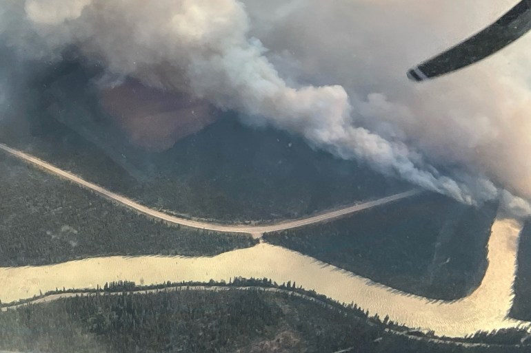 An aerial photo shows wildfire smoke rising over Jasper National Park, Alberta, Canada