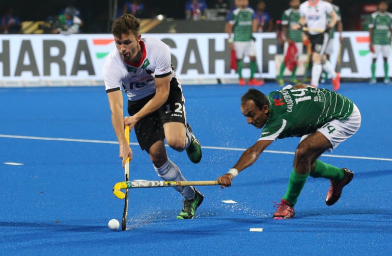 epa07201689 Germanys Timm Herzbruch (L) in action against Umar Bhutta of Pakistan during the men's Field Hockey World Cup match between Germany and Pakistan at the Kalinga Stadium in Bhubaneswar, India, 01 December 2018. EPA-EFE/HARISH TYAGI