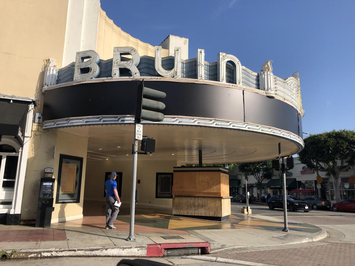 The ticket booth at the Regency Bruin theater in Westwood Village boarded up in 2020, during the COVID-19 shutdown.