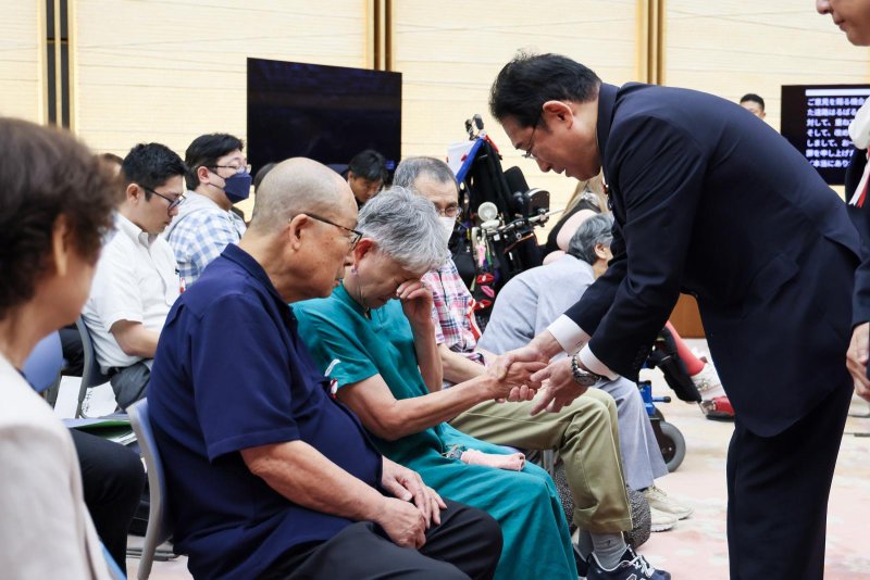 Prime Minister Fumio Kishida of Japan (R) on Wednesday apologized to victims of the country's now defunct eugenics law. Photo courtesy of Japan's Prime Minister's Office/Release